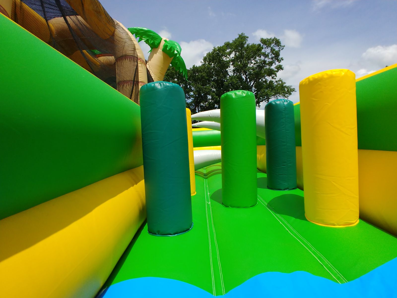 Inflatable pop-up obstacles within Tropical Hop N' Rock Obstacle Course